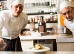 Two Chefs Working As A Team Stock Photo