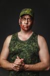 Creative And Funny Military Style Camouflage On Tankman Face Stock Photo