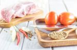 Culinary Background With Spices And Pork On Wooden Table Stock Photo