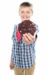 Young Boy Holding Chocolate Cookie Stock Photo