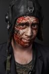 Creative And Funny Military Style Camouflage On Tankman Face Stock Photo