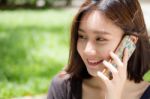 Portrait Of Thai Adult Student University Beautiful Girl Calling Smart Phone Stock Photo