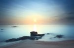 Cloud And Seascape And Rock At Dawn Stock Photo