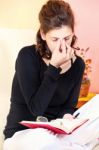 Tired Woman Of Reading A Book Stock Photo