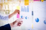 Businessman Making Presentation With His Colleagues And Business Stock Photo