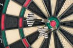 Dartboard And Two Arrows Stock Photo