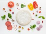 The Ingredients For Homemade Pizza On White Wooden Background Stock Photo