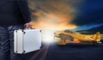 Business Man With Metal Strong Luggage Standing In Airport Runwa Stock Photo