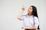 Portrait Of Thai High School Student Uniform Beautiful Girl Pointing Stock Photo