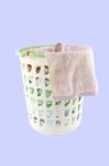 Basket Of Cloth Hang Before Washing On Blue Background Stock Photo