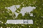 World Map And Keyboard On Garden Stock Photo