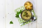 Mushroom Soup With A Bread Roll And Parsley Stock Photo