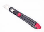 Black And Red Plastic Cutter Knife Isolated Stock Photo