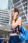 Portrait Of Thai Chinese Adult Glasses Beautiful Girl Denim Blue Calling Smart Phone Stock Photo