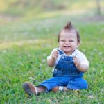 Baby Boy On Grass Stock Photo