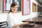 Portrait Of Thai Adult Businesswoman Beautiful Girl Using Computer Notebook Stock Photo