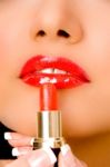 Close Up Of Beautician Applying Lipsticks On Woman's Lips Stock Photo