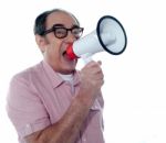 Senior Casual Man With Megaphone Stock Photo