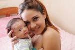 Portrait Of A Beautiful Hispanic Happy Mother With Smiling Baby Stock Photo