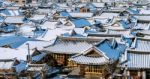 Roof Of Jeonju Traditional Korean Village Covered With Snow, Jeonju Hanok Village In Winter, South Korea Stock Photo