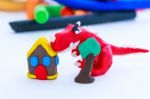 Creative Dinosaur, House And Tree Clay Model, On White Backgroun Stock Photo