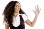 Hispanic Female Posing With Curly Hairs And Showing Palm Stock Photo