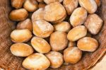 Wheat White Breackfast Bread Rolls In A Rustic Braided Basket Stock Photo