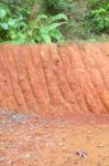 Vertical Red Cliff Of Small Level Ground Dig A Well Stock Photo