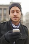 Man With Mobile Phone In Hands Stock Photo