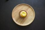 Portuguese Egg Tart On A Wood Dish Stock Photo