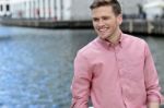 Handsome Young Man Posing Near River Stock Photo