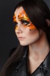 Orange And Red Rhinestones On A Girl Face Stock Photo