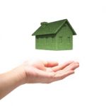 Green Eco House Concept  With Hand Stock Photo