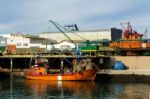 A Fishing Boat Moored In The Harbor Stock Photo