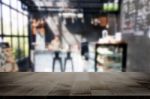 Selected Focus Empty Brown Wooden Table And Coffee Shop Or Resta Stock Photo