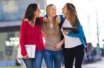 Friends Talking In The Street After Class Stock Photo