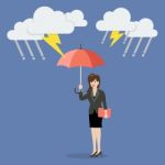 Business Woman With Umbrella Protecting From Thunderstorm Stock Photo