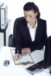 Busy Business Lady Making Her Notes On The Clipboard Stock Photo