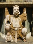 Statue Of Man At Wat Pho In Bangkok, Thailand Stock Photo