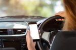 Woman Holding Phone In Car Clipping Path White Screen Stock Photo