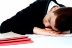 Sleeping School Boy With Notebook Stock Photo