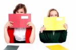 Schoolgirls Hiding their face Stock Photo