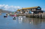 Boats In The Harbour At Lyme Regis Stock Photo