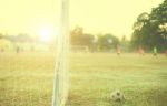 Old Football Vintage Photography With Soccer Goal With Lens Flare Effect Stock Photo