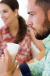 Handsome Businessman Drinking Juice In Office Stock Photo