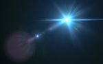 Digital Lens Flare In Black Background Horizontal Frame Warm Stock Photo