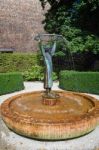 Statue Of A Man Holding A Hoop Fountain In St Gilgen Stock Photo