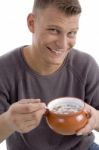 Smiling Man Eating Cornflakes Stock Photo