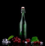 Wine Bottle With Red Grape Stock Photo