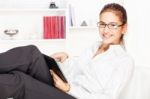 Woman Working On Tablet Computer Stock Photo